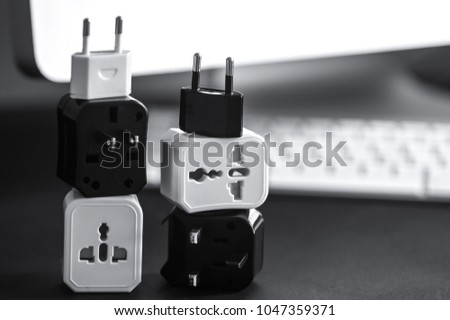 Triple Outlet Tap. Electric energy adapter used to split socket outlet. Isolated on computer background.