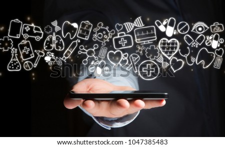 View of a Hand of a man holding smartphone with medical icons all around