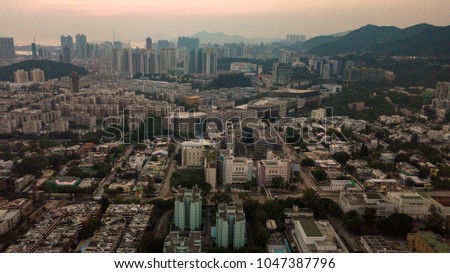 Aerial photo of sunset in Hong Kong with a lot of short buildings & street blocks