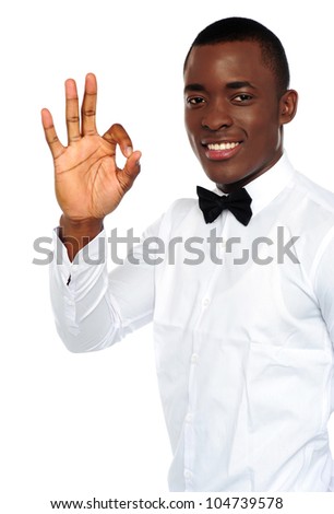 Young african boy showing okay gesture to camera