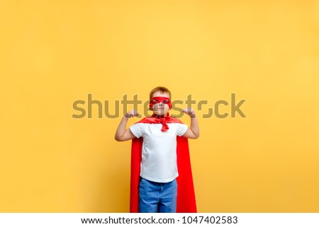 child superhero costume in the background