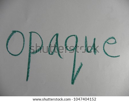 Text opaque hand written by green oil pastel on white color paper