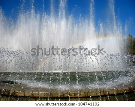 fountain with water drops and rainbows