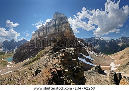 Pinnacle Mountain can be seen (center). Near Lake Louise, in Banff National Park, Alberta, Canada A 2-1/2 hour hike to Sentinel Pass. Larch Valley is on the left, Paradise Valley is on the right. Royalty-Free Stock Photo #104742269