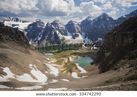 Looking back at Larch Valley from Sentinel Pass, Near Lake Louise, in Banff National Park, Alberta, Canada A 2-1/2 hour hike to Sentinel Pass. Royalty-Free Stock Photo #104742290