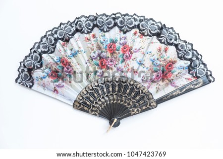 Traditional handheld fan. Flower painted folding fan. Oriental style open hand fan. Royalty-Free Stock Photo #1047423769
