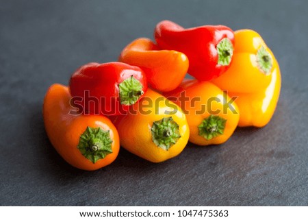 Macro view sweet bell peppers. Bright red yellow orange vegetables, shallow depth of field photo