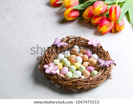 Easter decoration, Easter eggs and tulips.