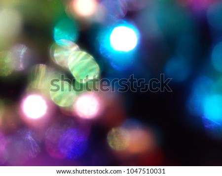 Colorful bokeh on black background.