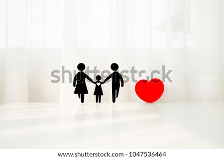 Medical Insurance Concept With Family Cut-out And Stethoscope On Wooden Desk