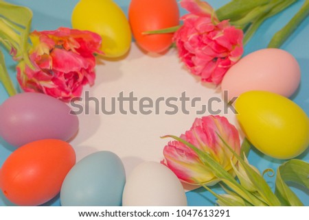 Colorful eggs on a blue background. Happy easter.