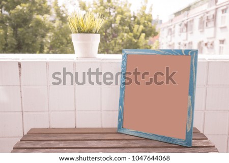 blank photo frame with copy space on balcony
