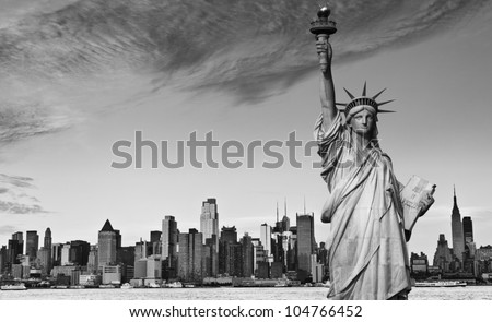 photo statue of liberty new york city black and white hi contrast. nyc new york city skyline over Manhattan cityscape midtown. statue of liberty over hudson river in new york city.