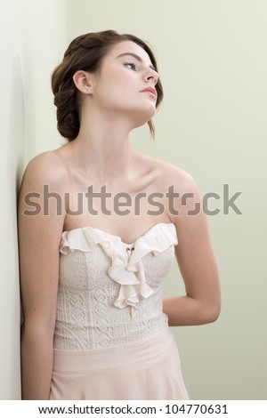 Natural photo of a beautiful young brunette woman in a dress