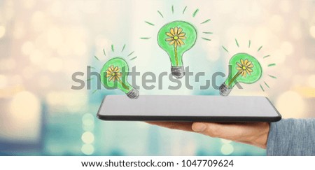 Eco Energy with man holding a tablet computer