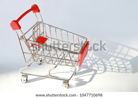 mini trolley on white background with shadow - selective focus