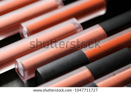 Fashion Colorful Lipsticks over black background,Professional Makeup and Beauty Lipsticks closeup Beautiful Make-up concept.