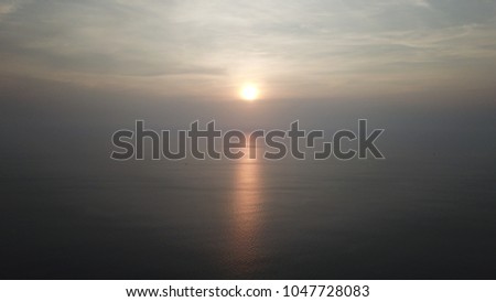 Aerial photo sunset over ocean  