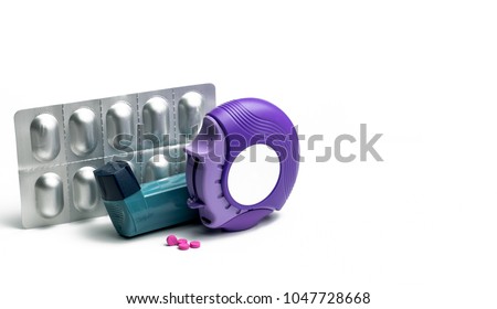 Set of asthma inhaler, accuhaler and anti-allergy pills for treatment asthma. Asthma controller, reliever equipment on white table with copy space. Bronchodilator and steroids drug for severe asthma. Royalty-Free Stock Photo #1047728668