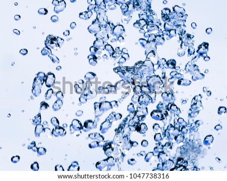 Flying drops.
Water drops in the air. Selective focus background