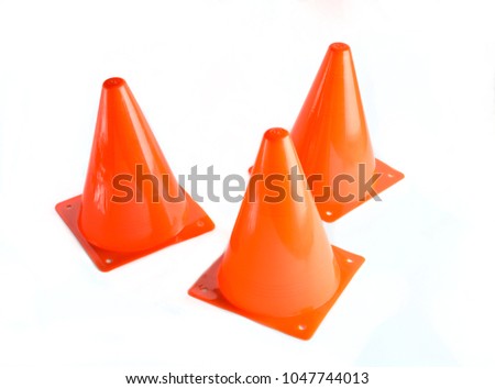 Three orange cone, road barrier isolated on a white background.