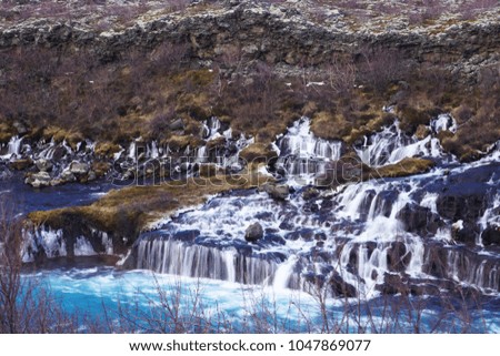 Clear blue Lava Waterfall in West Iceland, winter season in March, 