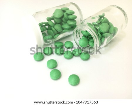 Pills spilling out of bottle