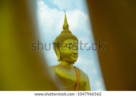 Buddha statue and blue sky in Nakhon Phanom province, Thailand. Statue of Buddha