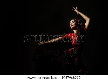 flamenco dancer on a dark background. free space for your text Royalty-Free Stock Photo #1047968227