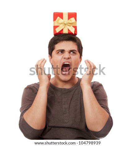 An angry man holding present box on white background.