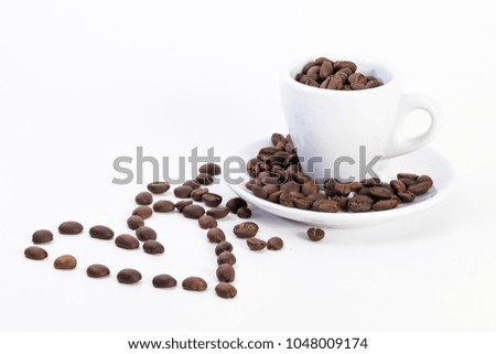 Coffee cup with coffee beans and a heart