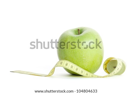 Green apple with measuring tape, isolated