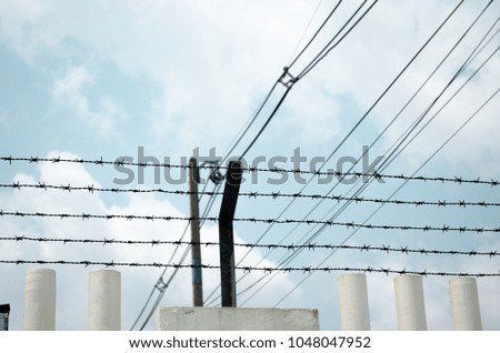 barbed wire wall and sky background