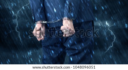 Stormy bad day concept with close handcuffed elegant man
