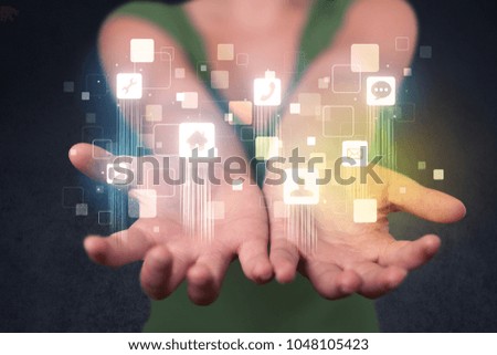 Blue social application icons in the hands of young casual businesswoman