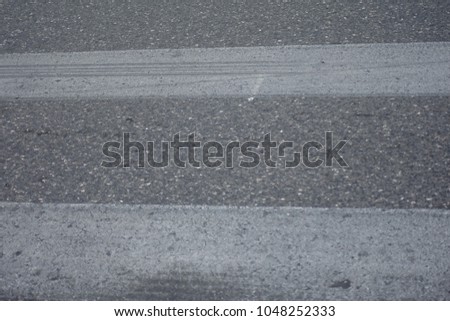Pedestrian marks on asphalt