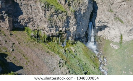 Elbrus from the north. The Sultan waterfall on the Kyzyl-Su river. Aerial view. Kabardino-Balkaria, Russia  