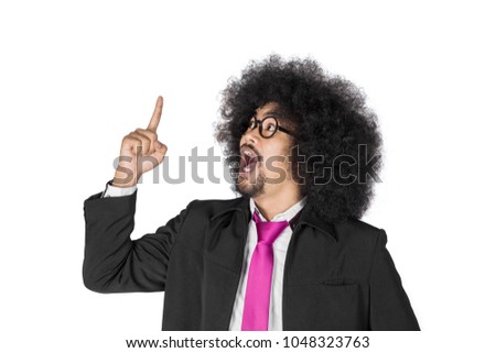 Picture of African businessman getting an idea while pointing upward, isolated on white background