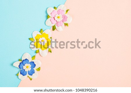 Romantic beautiful artificial colorful flowers with empty space for your text or message.