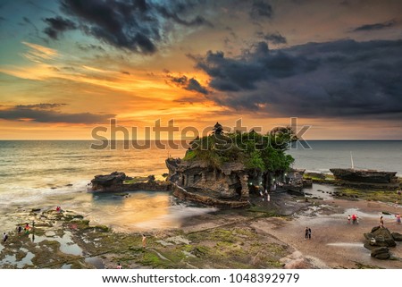 Beautiful sunset scenery at Tanah Lot, Bali, Indonesia Royalty-Free Stock Photo #1048392979