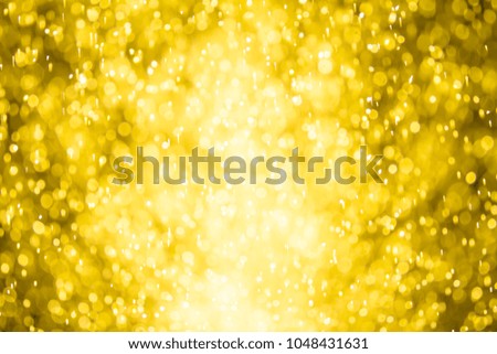 Abstract golden bokeh background of blurred lights.