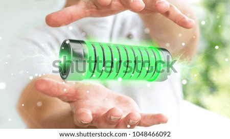 Businessman on blurred background using green battery with lightnings 3D rendering