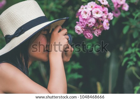 young beautiful girl looking at camera tourist travel taking picture holiday in flower garden weekend holiday lifestyle park outdoor nature background, photography journey backpack adventure outdoor.