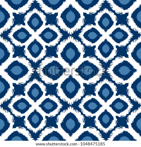Seamless ikat pattern in blue and white colors. Vector tribal background. Ethnic print for wallpaper, textile, clothing, web, scrapbooking design