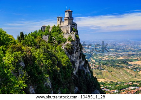 Fortress Guaita on Mount Titano is the most famous tower of San Marino, Italy. Royalty-Free Stock Photo #1048511128