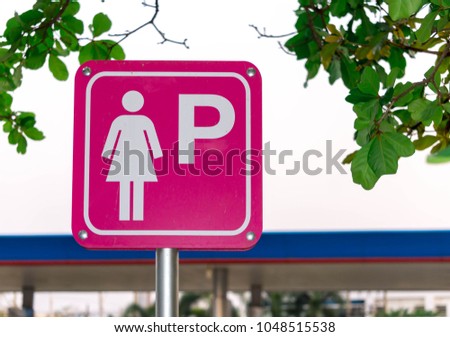 Signs symbols car parking for women or lady . Women's parking spaces usually near the exits to increase the safety of women, to the act of parking,and a symbol on the pole driver warning vehicle.