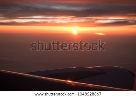 Beautiful sunset from airplane in the sky