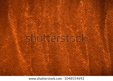 Colorful orange chalk pastel texture on black paper background. Abstract pencil strokes.