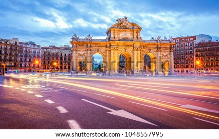 The Alcala Door (Puerta de Alcala) is a one of the ancient doors of the city of Madrid, Spain. It was the entrance of people coming from France, Aragon, and Catalunia. It is a landmark of the city. Royalty-Free Stock Photo #1048557995