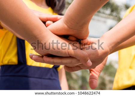 Conceptual symbol of multiracial human hands making a circle 